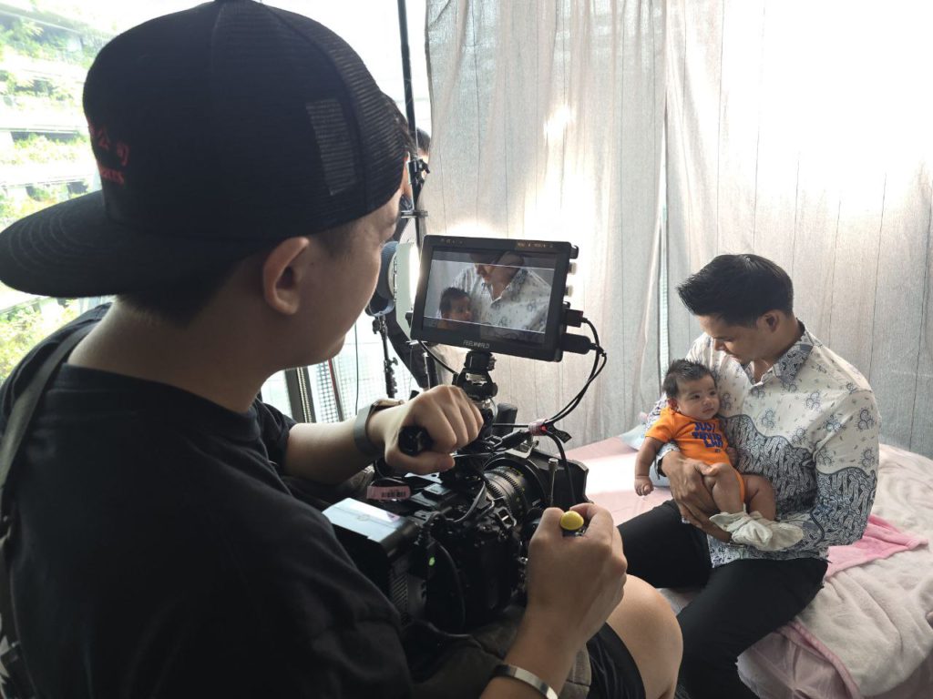 BTS Behind-the-scenes filming a makeshift home scene during creative video production