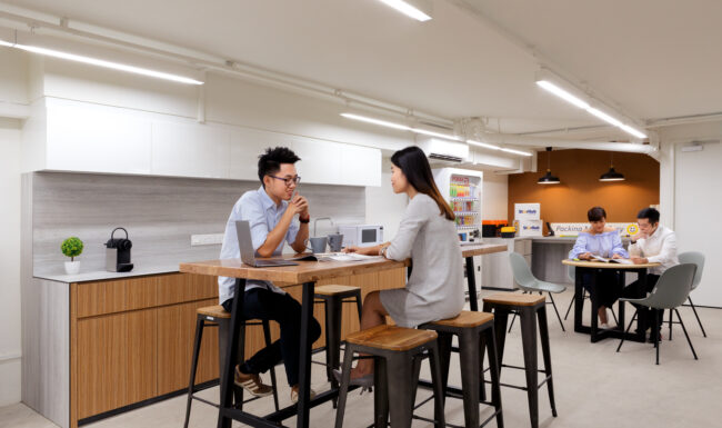 Coworkers in communal space for corporate photography