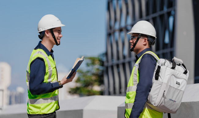 Construction workers with hard hats for a corporate photography