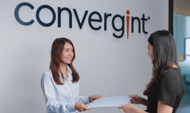 Two people collaborating at office desk for corporate photoshoot