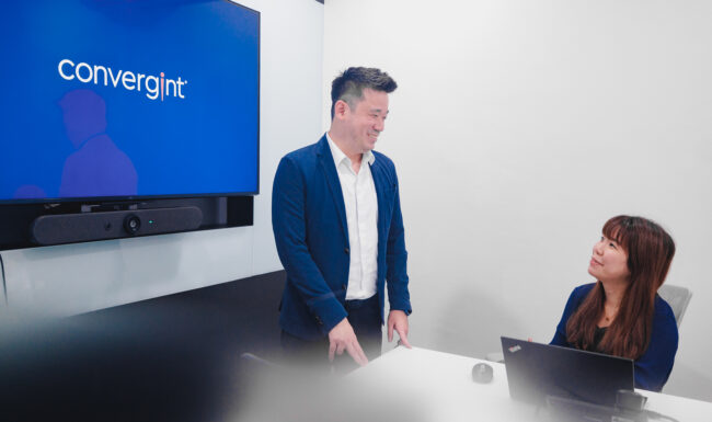 Two people working in meetings for corporate photoshoot.